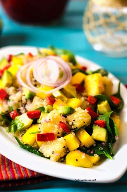 Avocado, Mango and Pineapple Quinoa Salad - This healthy vegan quinoa salad is easy to make and packed with flavor. Avocado, mango, pineapple and roasted red pepper combine to make an energizing and delicious salad.