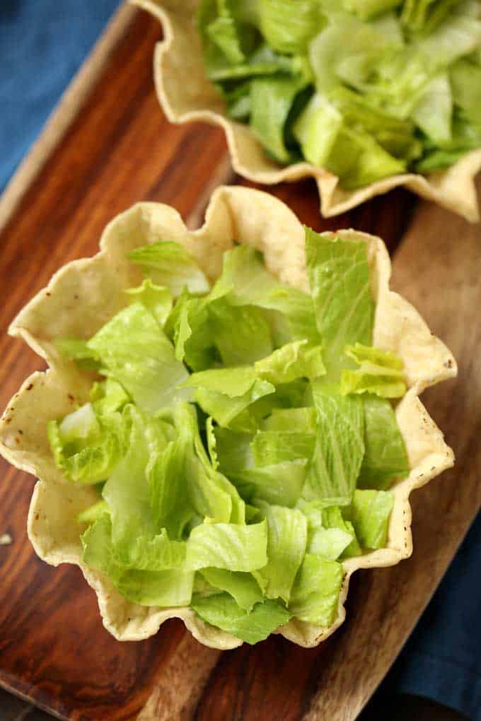 Photo of a tortilla bowl with lettuce.
