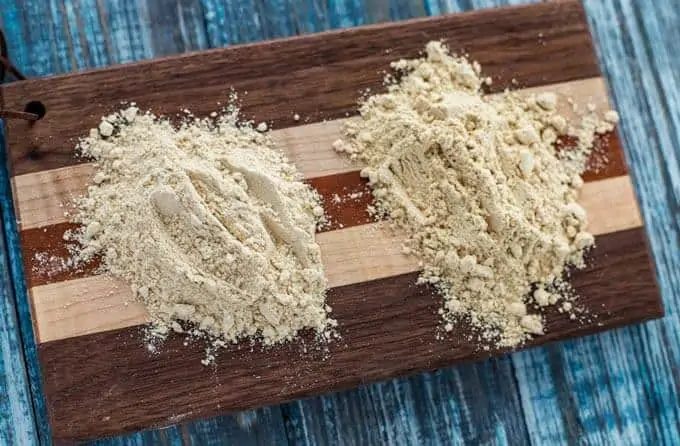 Photo of toasted and untoasted quinoa flour on a small cutting board.