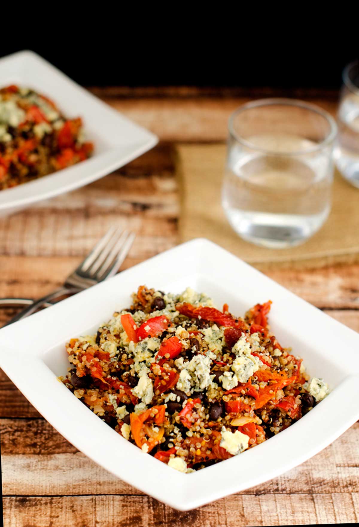 Photo of two square bowls of balsamic quinoa salad.