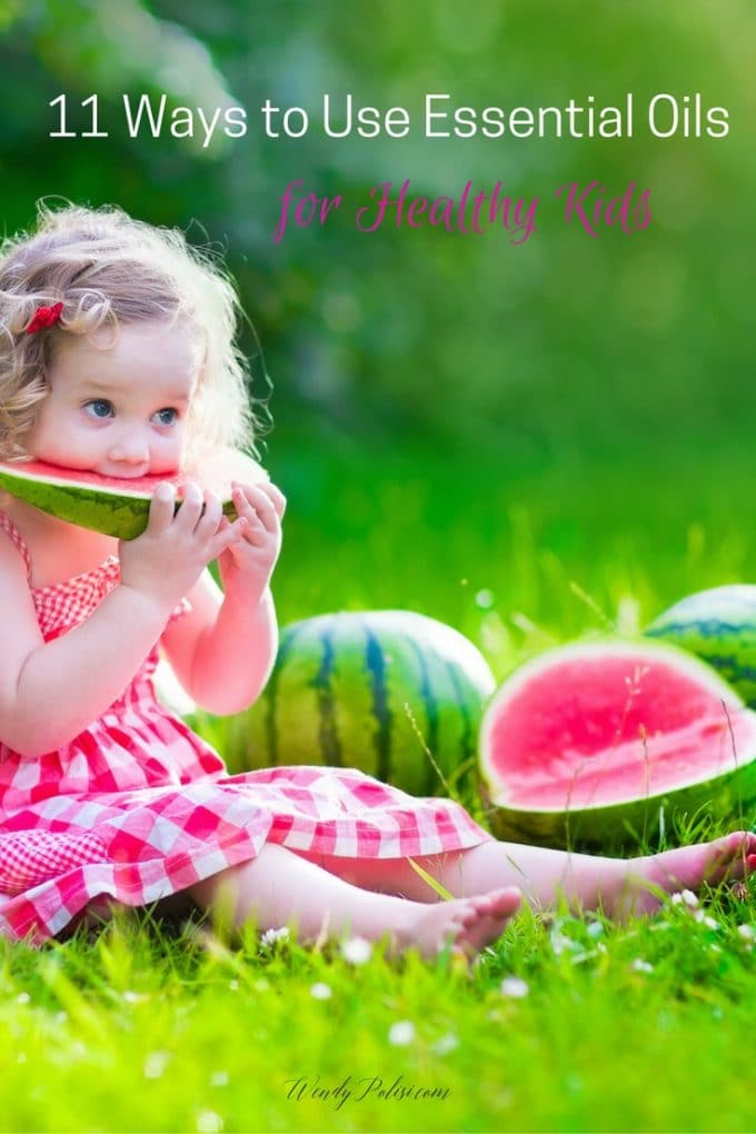 Photo of a little girl outside eating watermelon with the text Essential Oils for Kids.