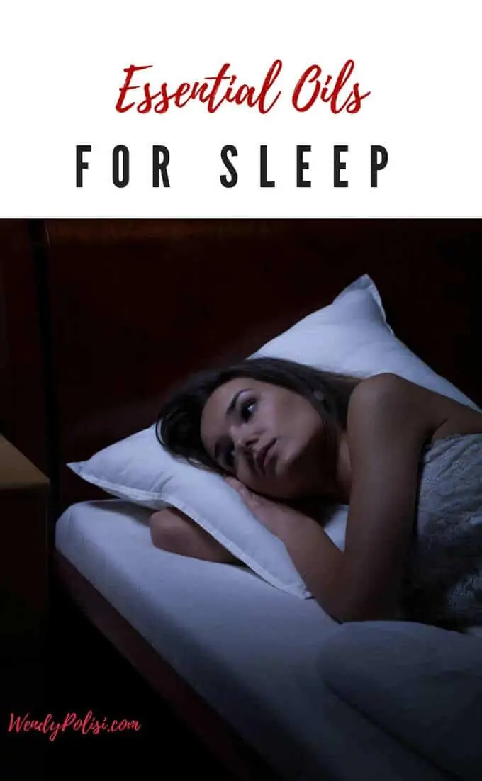 Photo of a sleepless woman lying in bed in the dark with the caption Essential Oils for Sleep above.
