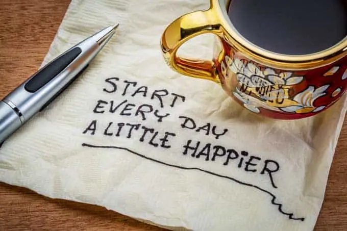Photo of a napkin that says Start Every Day a Little Happier - oils for depression.