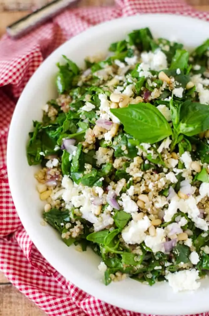 SThis Spinach Quinoa Salad with Feta and Pine Nuts is simple to make and makes a great side dish or vegetarian main course.