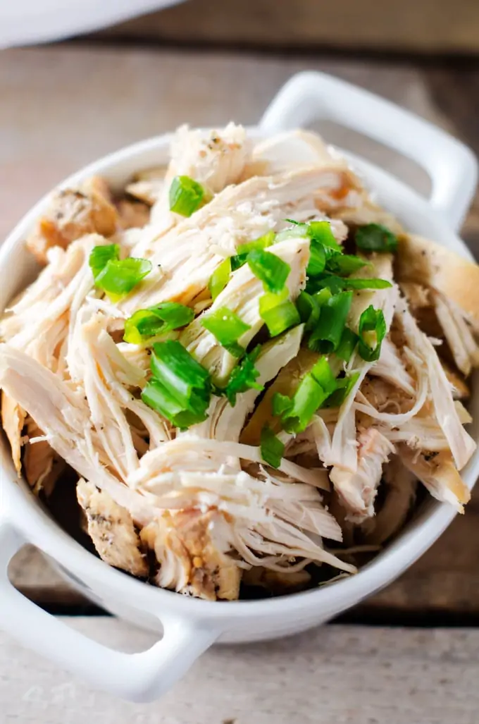 Easy Slow Cooker Shredded Chicken - This easy crockpot recipe helps you put healthy eating on auto-pilot. I love to make it on the weekends so that I have shredded chicken on hand to toss into salads, grain bowls, pasta dishes and burritos.