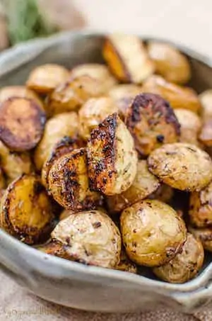 Crispy Oven Roasted Potatoes in a tan bowl.