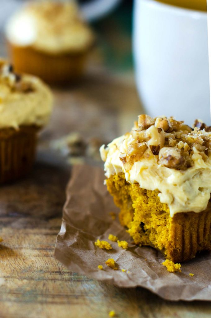 Gluten Free Pumpkin Muffins with a bite out of the first one.