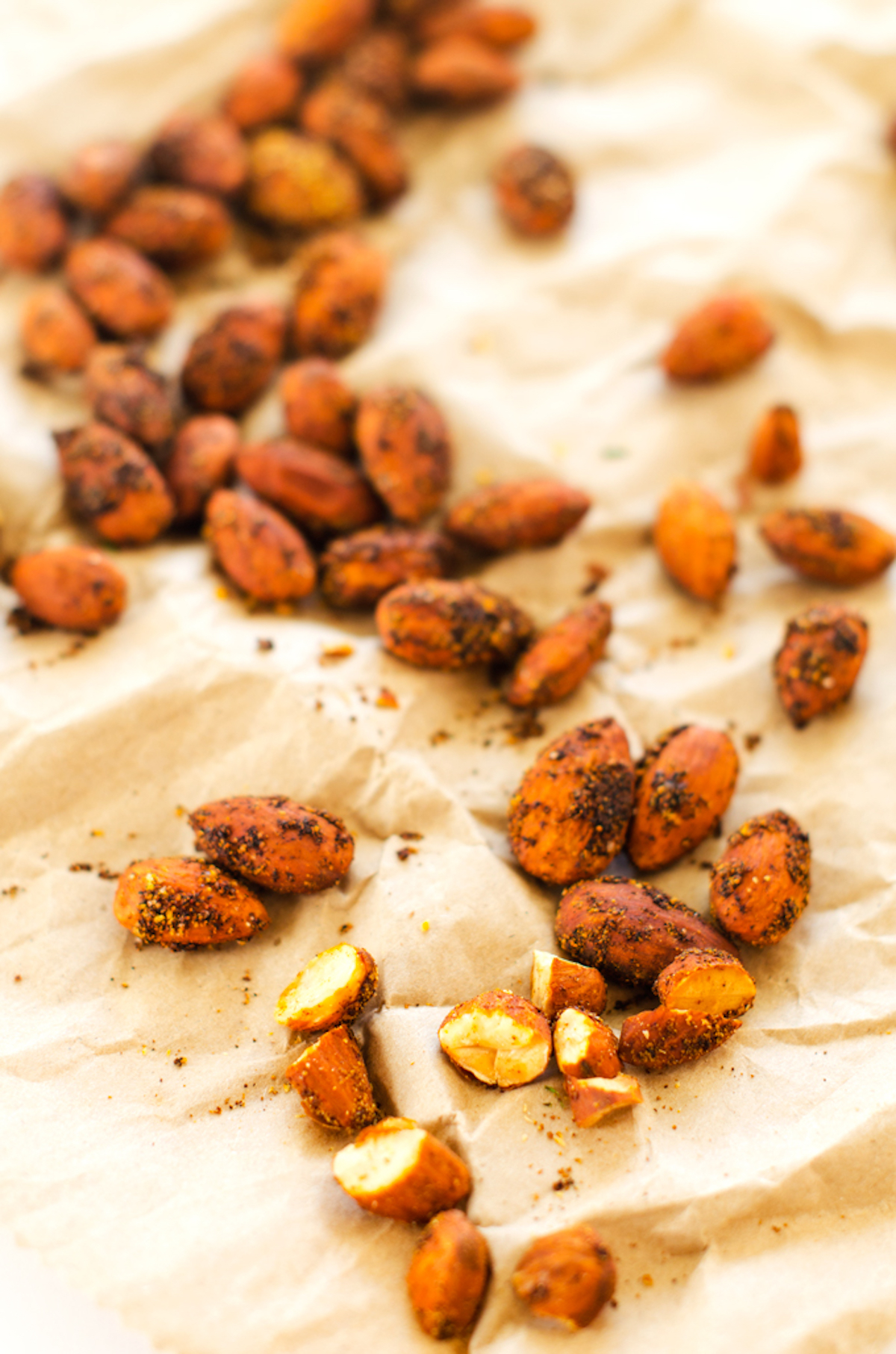 Photo of smoked almonds on parchment paper.