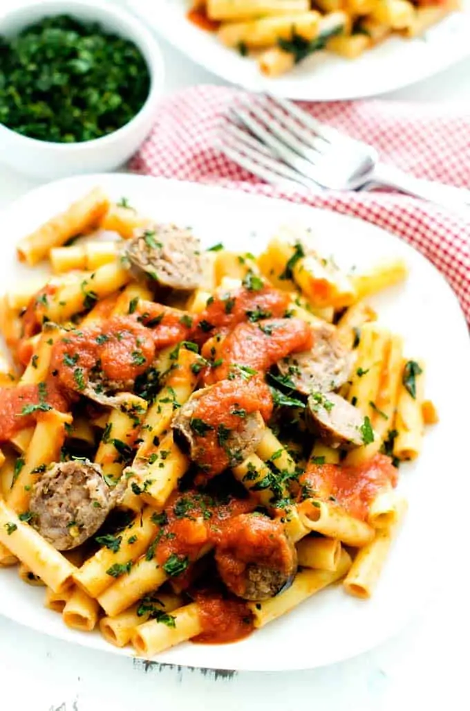 Up close photo of sausage spinach pasta.