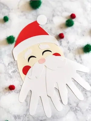 Photo of an easy Santa craft for kids . - DIY Handprint Santa.