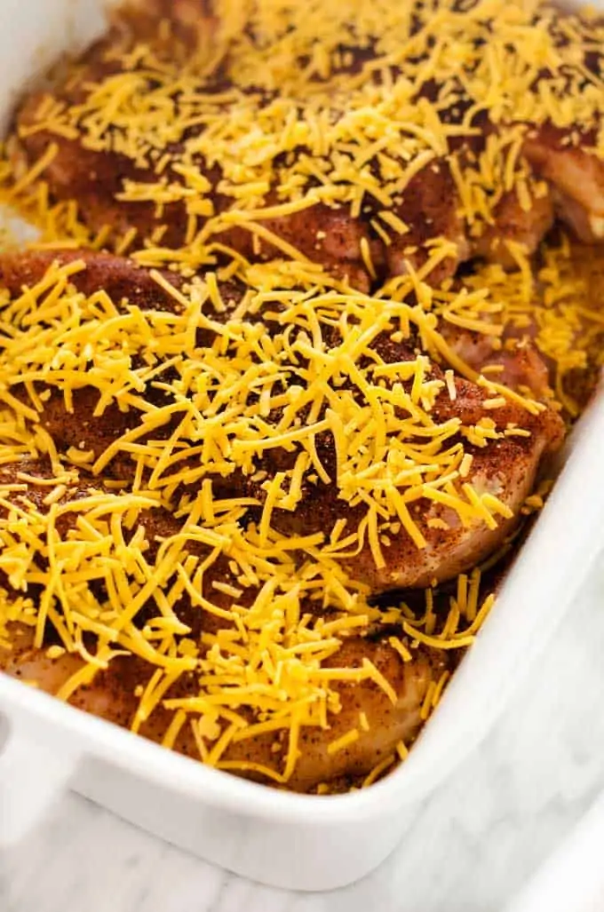 Photo of southwest chicken bake with cheese on top of it.