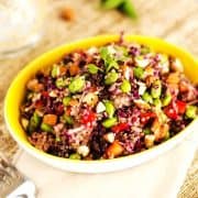 Square hoto of an Edamame Quinoa Salad in a yellow dish.