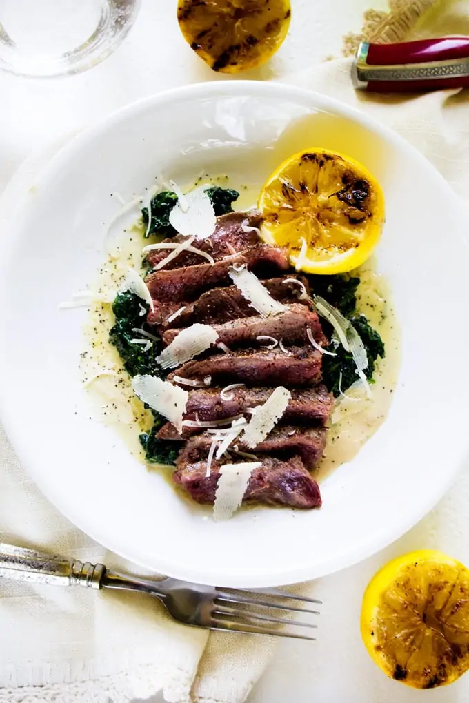 This Steak with Creamy Spinach & Parmesan is a simple but elegant meal that the whole family will enjoy. Perfect for your next grill out!