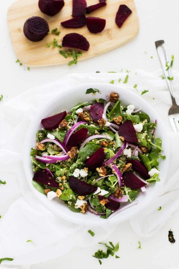 Shot of Roasted Beet Salad with Goat Cheese & Quinoa on a white background