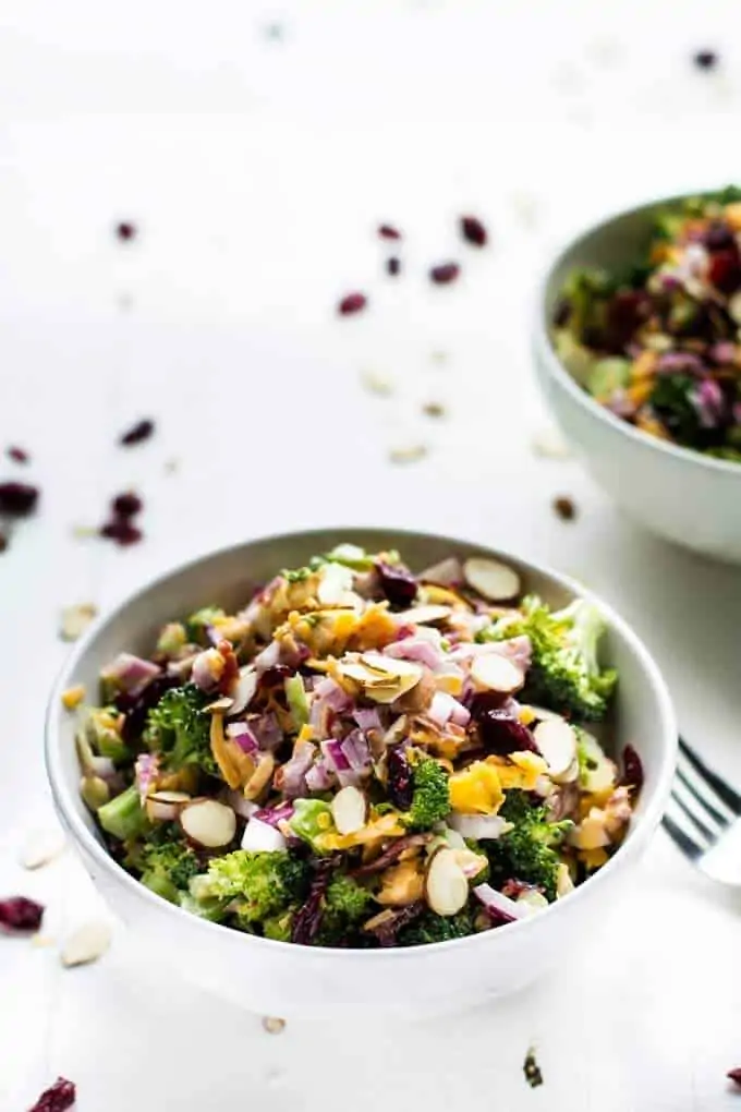 Two bowls of Broccoli Salad with Bacon and Cheddar Cheese - a healthy broccoli salad