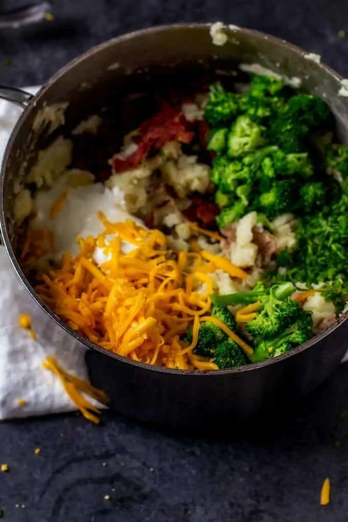 Ingredients for Cheesy Mashed Potatoes with Bacon and Broccoli in a saucepan