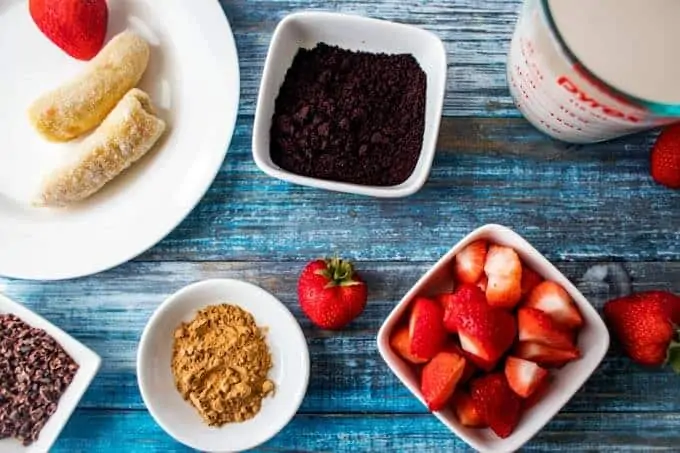 Ingredients for Acai Smoothie in small white dishes.