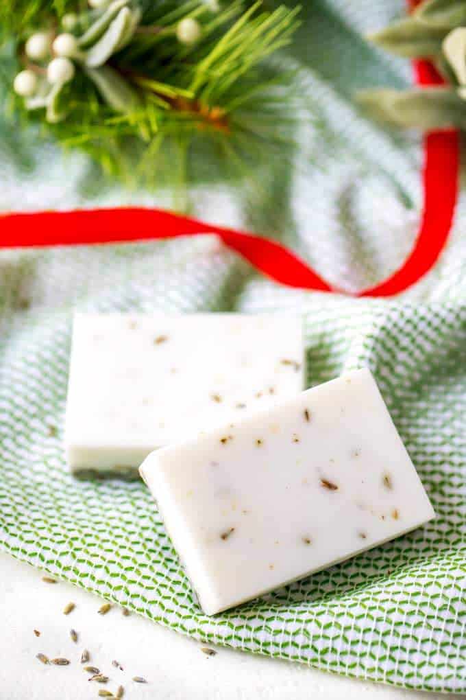 Picture of 2 bars of lavender soap with a holiday background | How to Make Lavender Soap