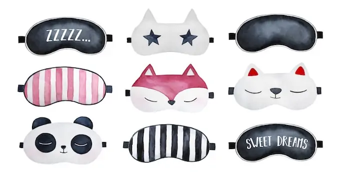 Cute photo of 9 different sleep masks against a white background.