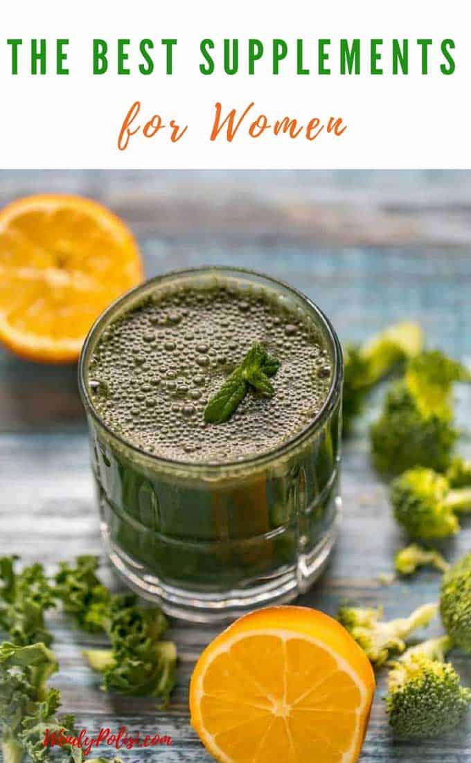 Photo of green juice in a glass garnished with mint and surrounded by kale, broccoli and lemon with the caption The Best Supplements for Women