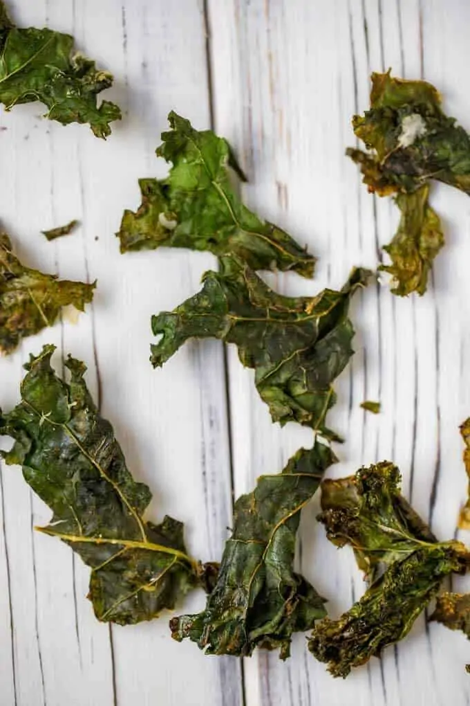 Photo of homemade kale chips on a wooden board