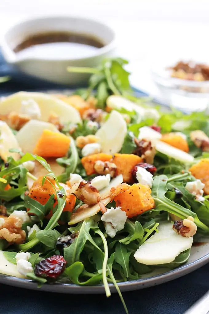 Satisfy your hunger and nourish your body with this delicious Butternut Apple Arugula Salad with Balsamic Dressing, loaded with tender roasted butternut, crisp sliced apple, spicy arugula, sprinkled with dried cranberries, walnuts, and creamy goat cheese.