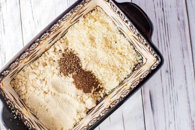 Photo of almond flour, Parmesan and seasonings in a shallow dish.