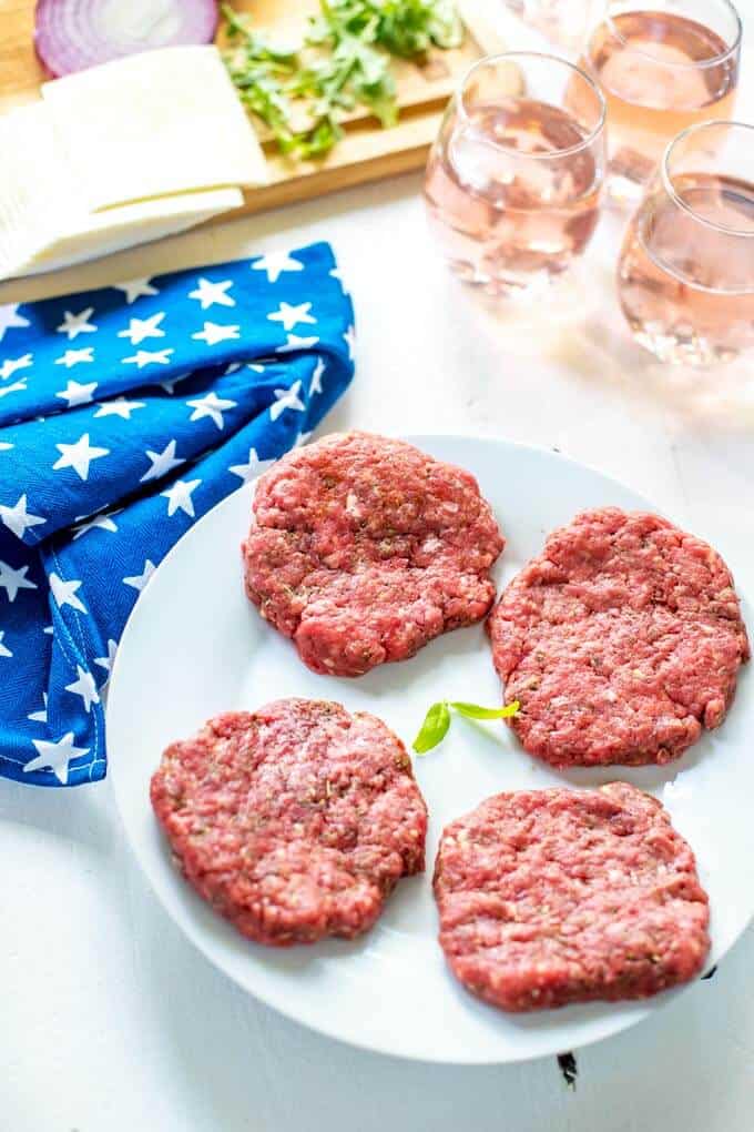 Photo of uncooked patties for Italian Burgers.
