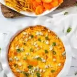 Photo of Healthy Buffalo Chicken Dip in a white pie plate.