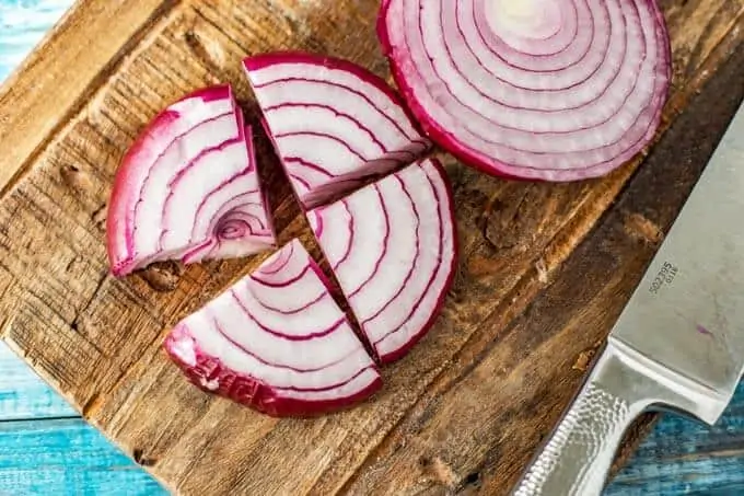 Photo of how to cut an onion for Halloumi Kebabs.