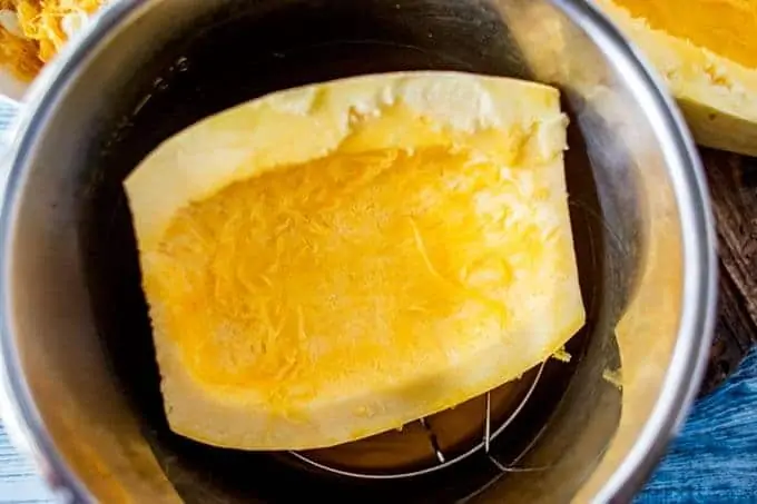 Uncooked spaghetti squash is being added to the Instant Pot.