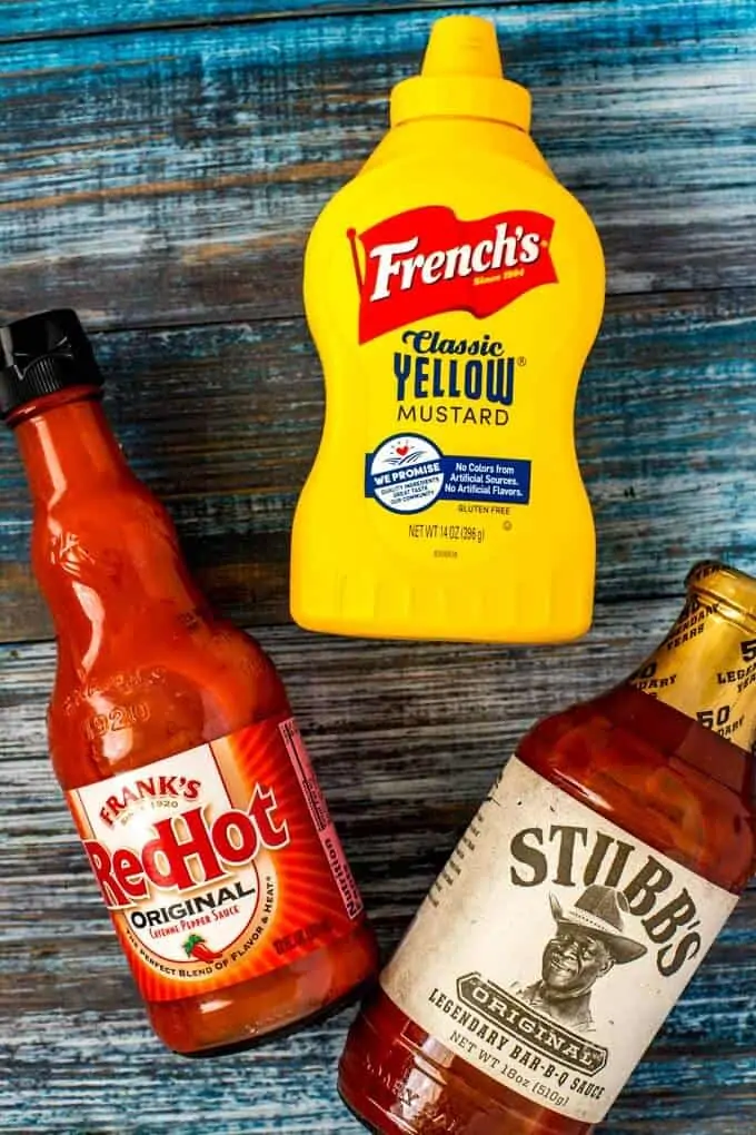 Product shot of Franks Red Hot Sauce, French's Mustard and Stubbs Barbecue Sauce.