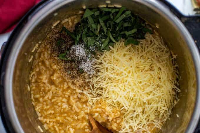 Cooked Instant Pot Risotto with the cheese and sage being added in.
