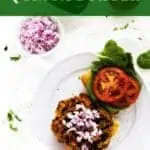Photo of a Black Bean Quinoa Burger on a white plate against a white background with the recipe title written on a green text overlay above it.