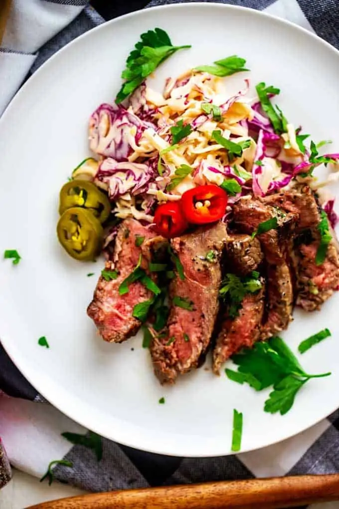 Photo of Grilled Steak with Spicky Slaw on a whtie plate.