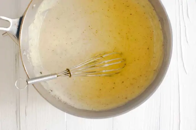 Cream of celery soup in a saucepan.