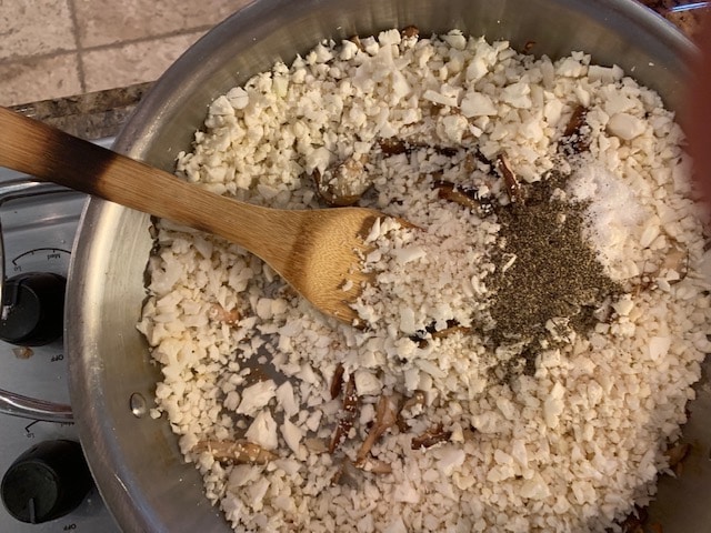 Photo of cauliflower rice in a large skillet.