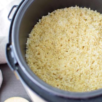 Overhead photo of quinoa that has been cooked in a rice cooker.