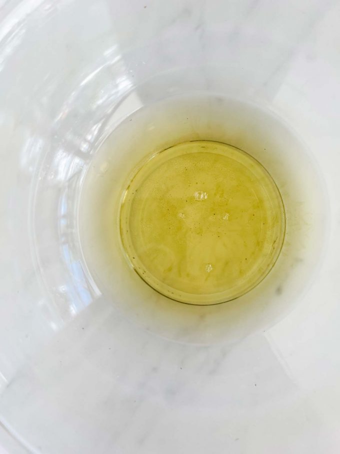 Photo of melted shea butter and coconut oil that has had essential oils added to it.