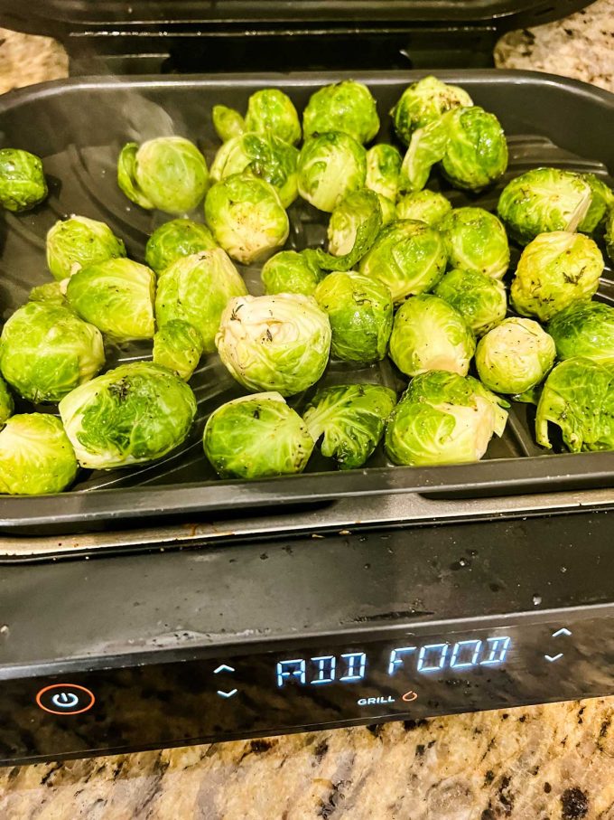 Photo of Brussels Sprouts Cooking on a Ninja Foodi Grill.
