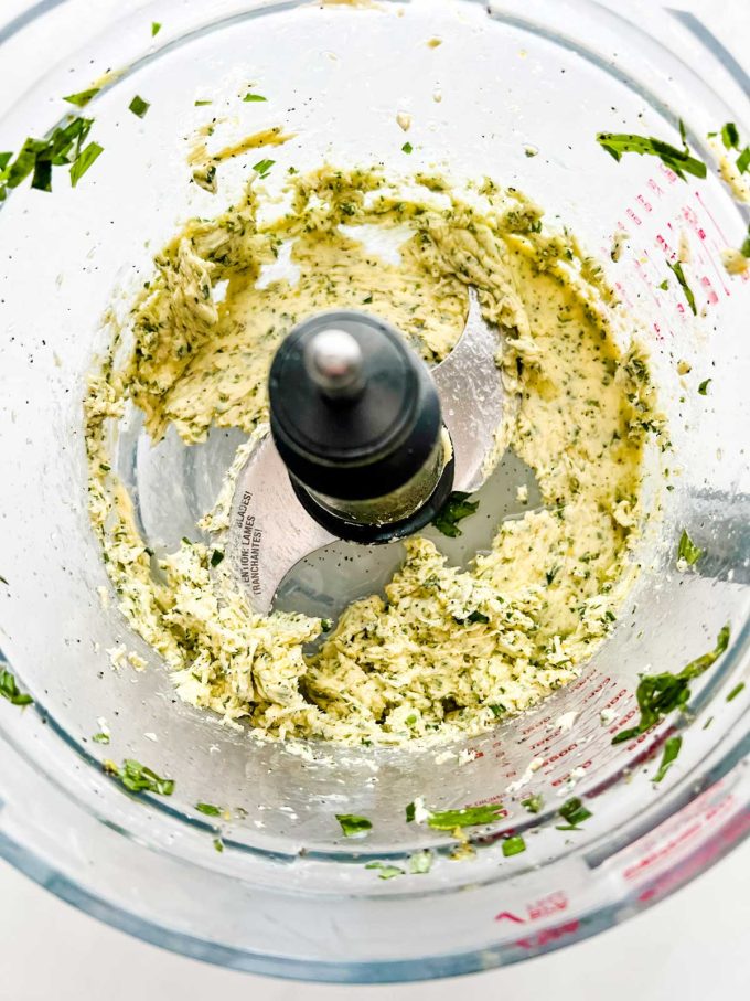 Photo of compound butter in a food processor.