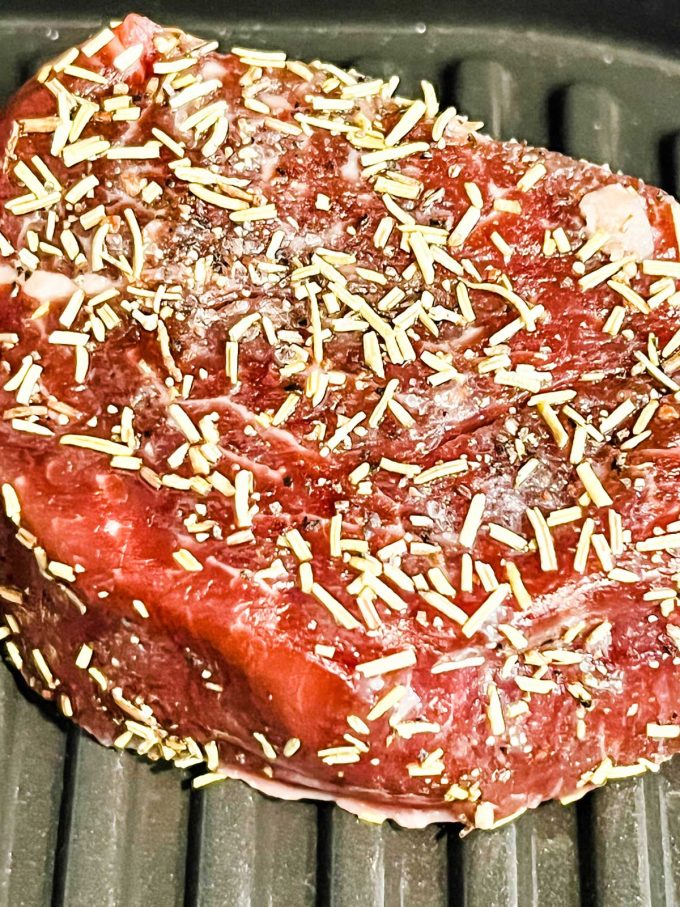 Close up photo of grilled filet mignon cooking.