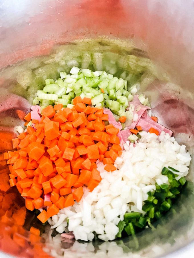 Photo of bacon and vegetables in an instant pot.