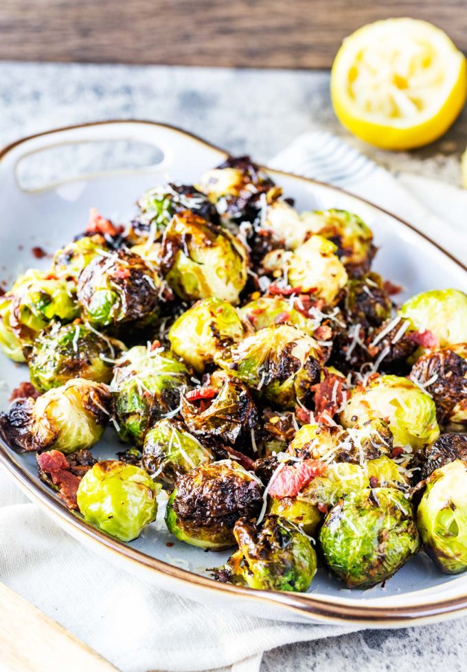 Side photo of a platter of Ninja Foodi Grill Brussels Sprouts.