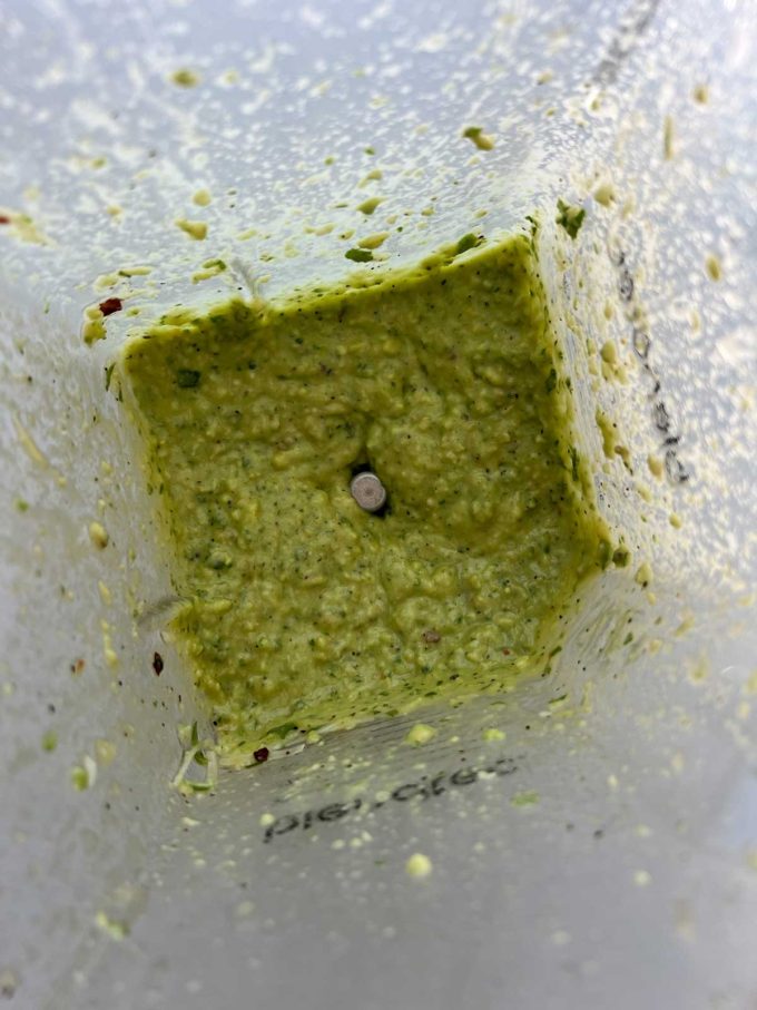 Photo of avocado pesto in a blender.