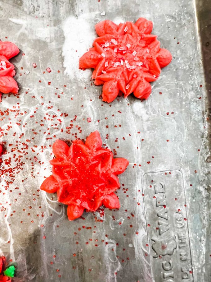 Photo of gluten free spritz cookies on a cookie sheet.