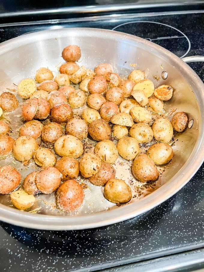 Photo of baby potatoes cooking on the stove top.
