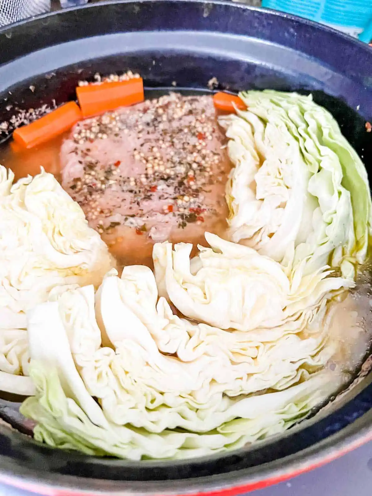 Photo of corned beef and cabbage in and Instant pot Dutch Oven.