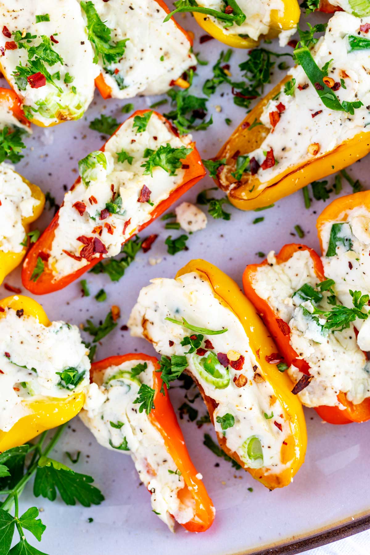 Close up photo of a platter of stuffed mini peppers.