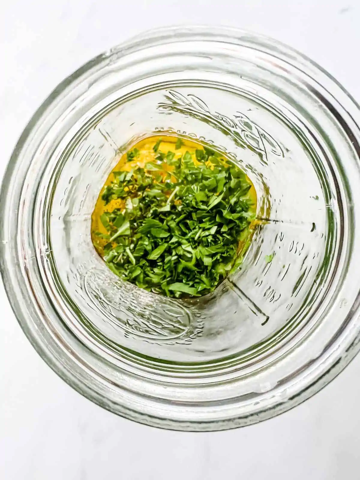 Salad dressing ingredients in a mason jar.
